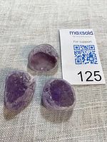 Three amethyst seer stones with lot card