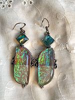 Front view of colourful silver earrings