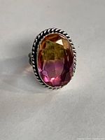 Front view of ring showing stone colours and bezel