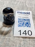 Front view of ring showing faceted black onyx and silver setting