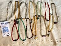 Group shot of all crystal ankle bracelets laid out on fabric