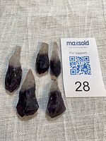 Five tapered amethyst crystals beside MaxSold lot card