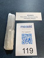 Full view of selenite crystal with label card