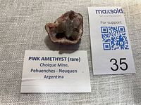 Overall view of pink amethyst specimen with info card