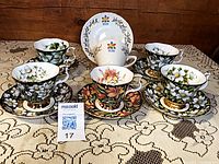 Five Royal Albert Provincial Flowers cup and saucer sets with Centennial plate behind