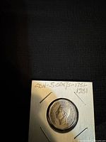 Obverse view in flip showing King George VI portrait