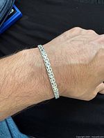 Bracelet worn on wrist showing overall appearance and scale