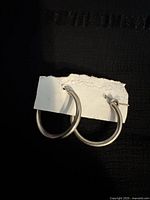 Full view of both hoop earrings on card