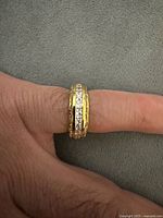 Ring on finger showing band profile and stone setting