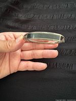 Bracelet front showing dark inlay panel and silver frame