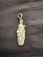 Front view of sterling silver religious figure pendant