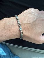 Bracelet worn on wrist showing overall appearance and scale