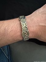 Bracelet worn on wrist showing design and scale