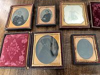 Group shot of all five cased daguerreotypes showing cases and mats