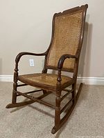 Full view of walnut cane rocking chair