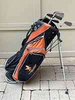 Full view of Callaway stand golf bag with clubs inside, legs extended