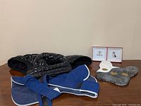 Overall lot view: two jackets, two bowls, stone tray