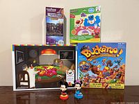 Group shot of all boxed puzzles/games and figurines