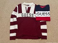 Both Guess shirts side by side folded and laid flat