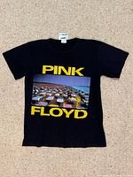 Full view of front of T-shirt showing graphic and tag