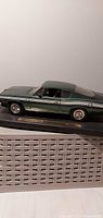 Full view of 1:18 scale 1969 Plymouth Barracuda model on base
