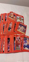 stacked red-border Donruss baseball cards spread on surface