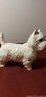 Left side view of white ceramic Scottie dog