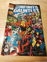Front cover of The Infinity Gauntlet comic showing title, Marvel logo, artwork