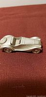 Side perspective of pewter BMW 328 miniature