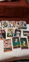 Overview of all twelve baseball cards spread on table