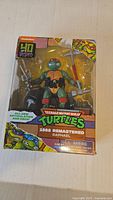 Front of sealed Raphael 1988 Remastered figure in window box