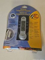 Front view of sealed Bass Pro Shops Wireless Temperature Station package