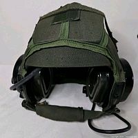 Front view showing helmet shell, earcups, chin strap