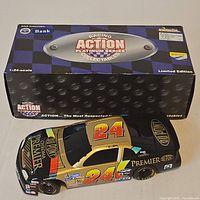 Box with Racing Action Platinum Series branding and die-cast car bank displayed
