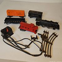 Group shot of entire lot showing locomotive, cars, transformer, track