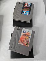 Front view showing both NES cartridges and dust sleeves