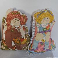 Front view of both Cabbage Patch Kids pillows