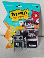 Front of sealed Conky action figure on colourful Pee-Wee's Playhouse card