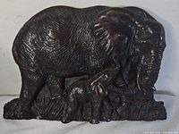Front view of resin elephant and calf figurine