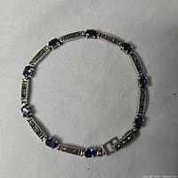 Full view of sterling silver bracelet with blue stones and marcasite bars