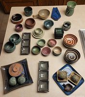 Top view of entire lot showing bowls, plates, cups and trays