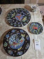 Full set view: charger, dinner plate, small plate, cup