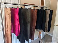 Rack view of seven leather and suede garments