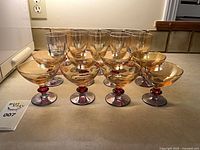 Full set of 18 tri-colored stemware on countertop