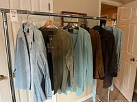 Rack of Danier suede jackets, shirt and skirt