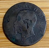 Obverse of coin showing worn portrait and legend