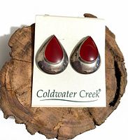 Front view of earrings on card showing red Carnelian and silver teardrop design
