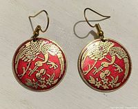 Front view showing enamel crane motif and color