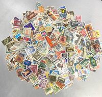 Top-down view showing full quantity and variety of stamps spread out