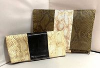 Both eel leather clutches side by side folded